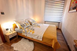 Postel nebo postele na pokoji v ubytování Apartmani Maltar
