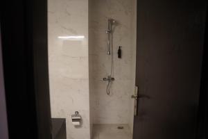 a shower stall in a bathroom with a shower at Ista Vacation Homes Rental LLC in Dubai +21 photos