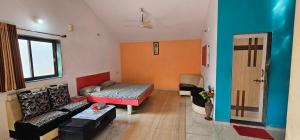 Postel nebo postele na pokoji v ubytování Hotel Maruti Resort