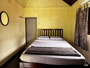 Postel nebo postele na pokoji v ubytování ABC Chalet Tioman