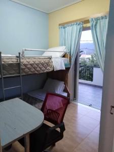 เตียงในห้องที่ Alexadra's house Κάτω Αλμυρή