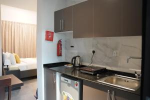 a kitchen with a sink and a counter top at Ista Vacation Homes Rental LLC in Dubai
