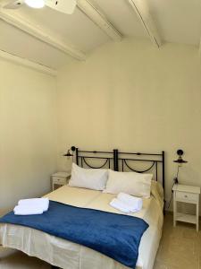 Ένα ή περισσότερα κρεβάτια σε δωμάτιο στο Casa Michela
