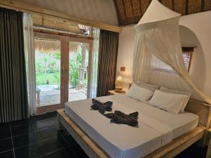 MoonBag Bungalows客房内的一张或多张床位