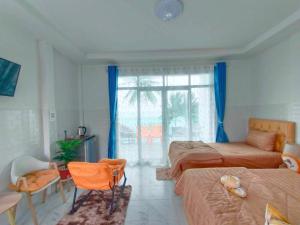 Posezení v ubytování Sichon Lalla Beach สิชล ลัลลา บีช + 31 fotografií