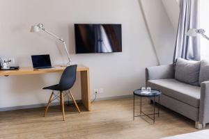 Un televizor și/sau centru de divertisment la Royal Hotel - Urban Living
