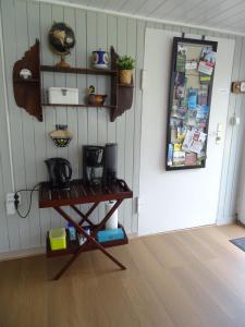 a room with a table in front of a door at B&B Piccardie in Emlichheim