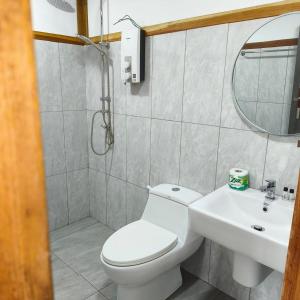 a bathroom with a toilet and a sink and a mirror at Koh kood Neverland beach resort in Ko Kood