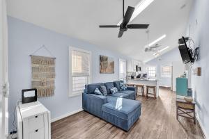 a living room with a blue couch and a table at Cozy 3-BR Retreat, Four Blocks to Beach & Boardwalk home in Seaside Heights +24 photos