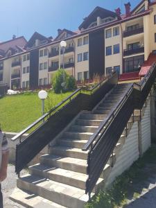a set of stairs in front of a building at Holiday home with indoor fireplace in Pamporovo