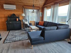 a living room with a couch and a chair at The view of Skattungbyn in Skattungbyn