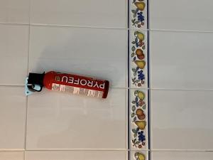 a bottle of toothpaste on the wall of a bathroom at Chicflat Avenida España Ideal para familias in Estepona