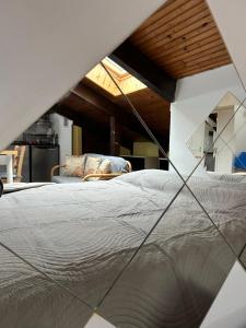 a close up of a bed in a room at Casa Parco Dora Torino - Intero Monolocale vicino al Centro e Allianz Stadium Juventus in Turin