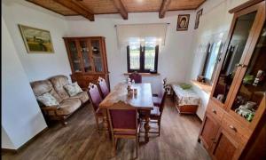 a living room with a table and a couch at Gospodarstwo Agroturystyczne ŻARNOWIEC in Dubicze Cerkiewne +12 photos