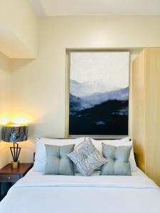 Ένα ή περισσότερα κρεβάτια σε δωμάτιο στο 26 Affordable Luxury Studio