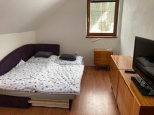 Postel nebo postele na pokoji v ubytování Apartmán pod kopcom