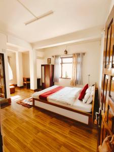 Postel nebo postele na pokoji v ubytování Jain Homestay