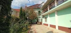 a house with a driveway in front of it at Guest House Sirius in Chişinău