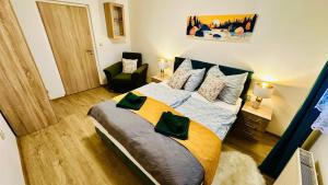 Postel nebo postele na pokoji v ubytování Rodinný apartmán na Šumavě