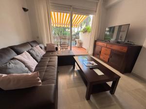 TV/trung tâm giải trí tại Ola Blanca Carihuela Apartamento