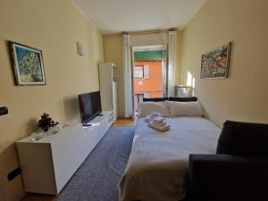 Ένα ή περισσότερα κρεβάτια σε δωμάτιο στο Natale a Verona - Casa Sant'Eufemia