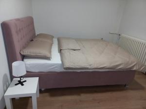 Postel nebo postele na pokoji v ubytování Apartman Mina