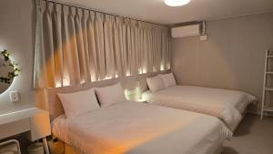 Katil atau katil-katil dalam bilik di 207stay korea +101 gambar