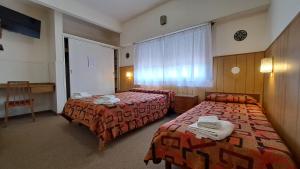 Postel nebo postele na pokoji v ubytování Hotel Massa