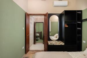 a bedroom with a bed and a large mirror at Harbour Heights in Birgu +13 photos