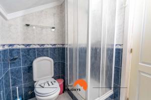 a bathroom with a toilet and a shower at #039 Family Private Pool AC in Vale de Pedras +41 photos