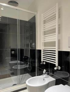 a bathroom with a sink and a shower and a toilet at LOFT 13 Maiori in Maiori +27 photos