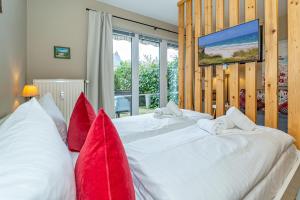 En eller flere senge i et værelse på Treibholz Appartment