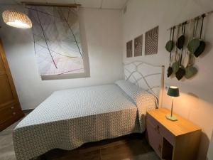 A bed or beds in a room at Alojamientos Rurales Cuatro Estaciones