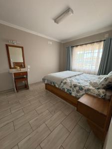 Postel nebo postele na pokoji v ubytování Oewerpark Accommodation