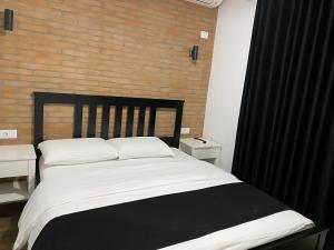 Postel nebo postele na pokoji v ubytování Hotel Sidi