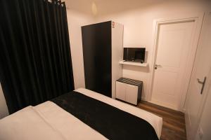 Postel nebo postele na pokoji v ubytování Hotel Sidi