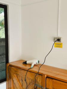 a writing instrument sitting on top of a wooden table at Pig Dive Hostel Moalboal in Moalboal
