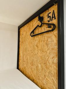a clock on the wall of a room at Pig Dive Hostel Moalboal in Moalboal
