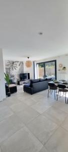 Posezení v ubytování Maison Cosy A L 'Orée du bois