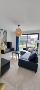 Posezení v ubytování Maison Cosy A L 'Orée du bois