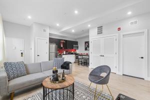 a living room with a couch and a table at 2C - Parking Cred, Early CI, King Bed, Sleeps 6 - 30mins to NYC in Newark