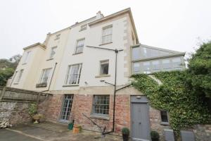 an old brick building with a door in front of it at Large clifton one bed flat and parking in Bristol