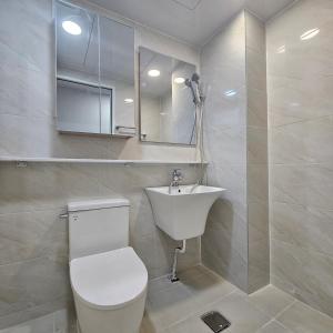 a bathroom with a toilet and a sink at Namsan Rooftop in Seoul +91 photos