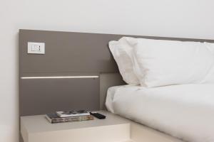 Postel nebo postele na pokoji v ubytování Excelsior Station Suite + 37 fotografií