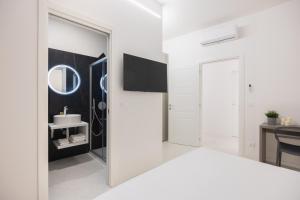 Postel nebo postele na pokoji v ubytování Excelsior Station Suite