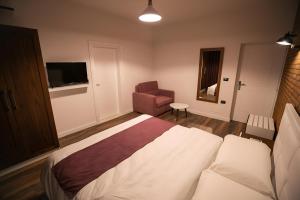 Postel nebo postele na pokoji v ubytování Hotel Sidi