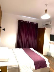 Postel nebo postele na pokoji v ubytování Hotel Sidi