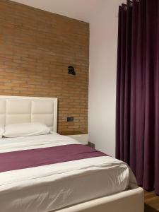 Postel nebo postele na pokoji v ubytování Hotel Sidi