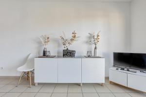 Et tv og/eller underholdning på Les 3 Ondes - Avec terrasse