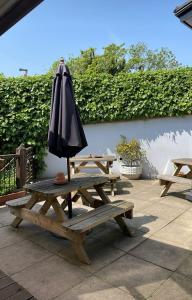 an umbrella sitting on top of a picnic table at Lower Bell in Aylesford
